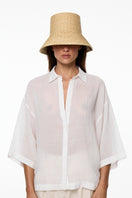 Beige bucket hat from LE SH KA featuring a wide brim and casual style, perfect for sun protection and everyday wear.