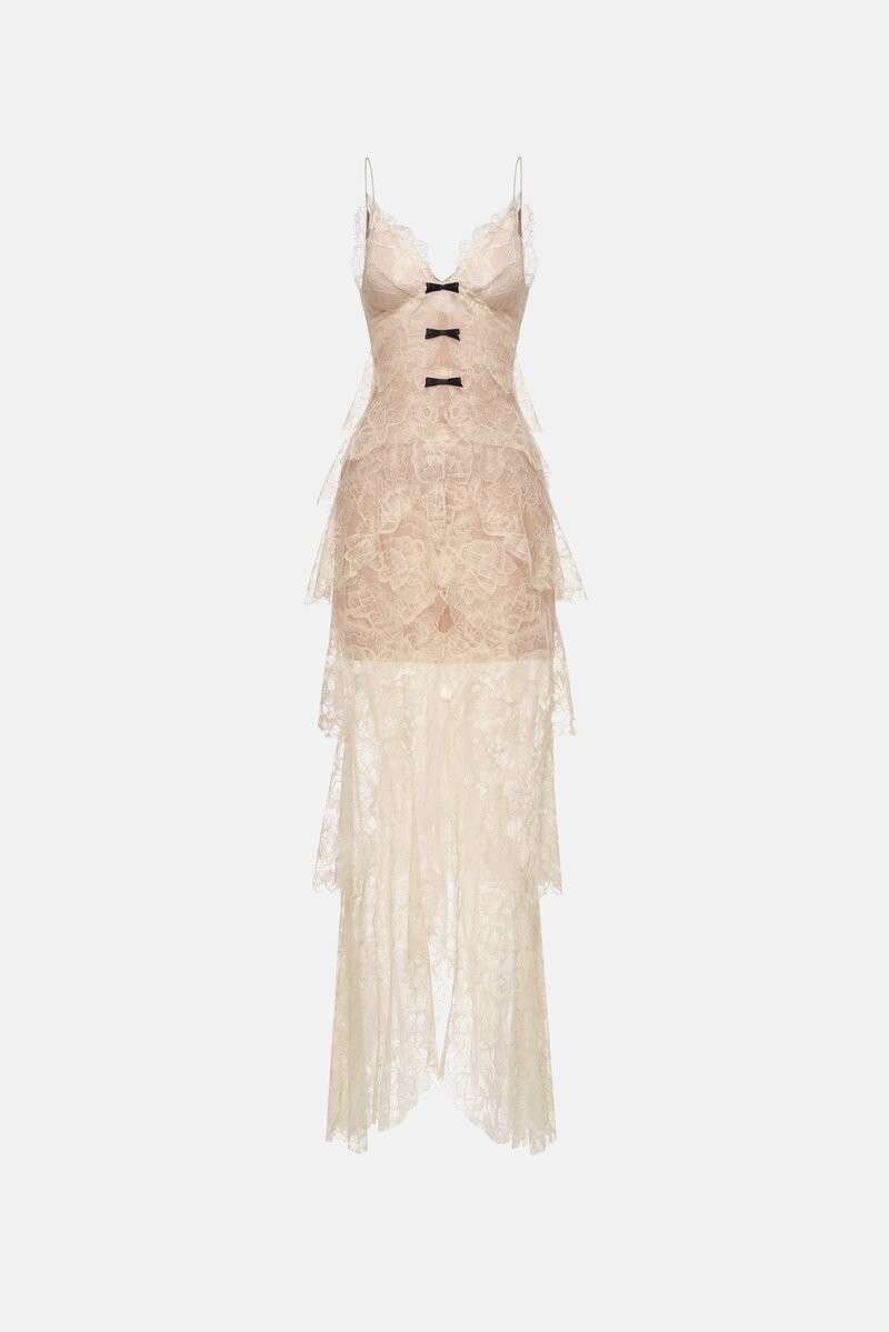 Beige floral bow V-neck maxi dress by Montsand, featuring a flowing silhouette and elegant floral pattern.
