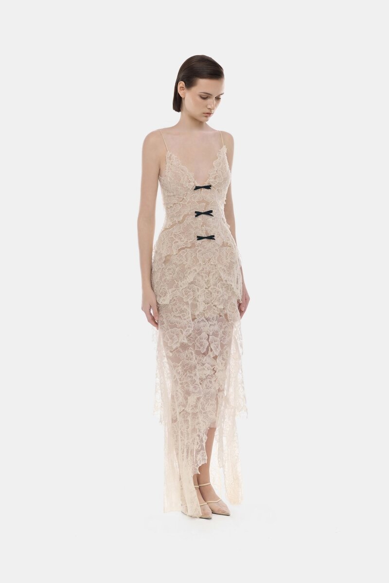 Beige floral bow V-neck maxi dress by Montsand, featuring a V-neckline and elegant flowy fabric.