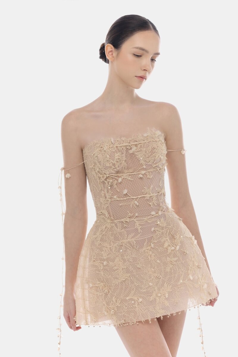 Beige floral string mini dress by Montsand, showing lightweight fabric, floral pattern, and adjustable thin straps.