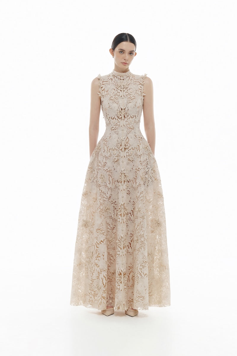 Beige flower beaded gown by Montsand featuring intricate beadwork and flowing maxi dress style.