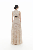 Beige flower-beaded gown by Montsand, elegant maxi dress with intricate beadwork and flowing fabric, perfect for formal occasions.