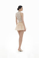 Beige flower beaded top from Montsand, paired with matching skirt, showing intricate beadwork and floral design on the stylish top.