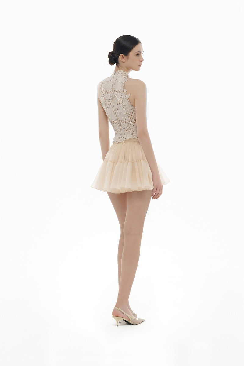 Beige flower beaded top from Montsand, paired with matching skirt, showing intricate beadwork and floral design on the stylish top.