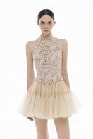 Beige flower beaded top from Montsand, shown with matching skirt, featuring intricate beadwork and floral design.