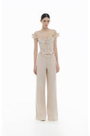 Beige flower beaded corset top from Montsand, featuring intricate beaded floral details and a fitted design, paired with matching trousers.