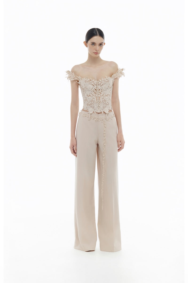Beige flower beaded corset top from Montsand, featuring intricate beaded floral details and a fitted design, paired with matching trousers.