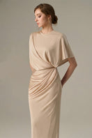 Beige jersey maxi dress with gathered waist and tie detail by I.H.F, featuring a flowing silhouette and elegant design.