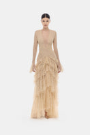 Beige lace cascade maxi dress by Montsand featuring flowing fabric and elegant design, perfect for formal occasions.