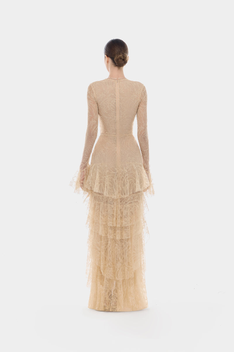 Beige lace cascade maxi dress by Montsand featuring flowing fabric and elegant design, perfect for formal occasions.