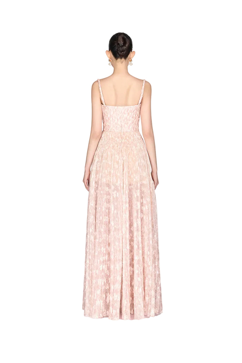 Beige pleated maxi dress by Montsand featuring flowing fabric and elegant design, perfect for summer or formal occasions.
