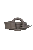 Taupe leather belt from ISIDORA MALVA's BELEN BELT collection, featuring a sleek, stylish design with a silver buckle.