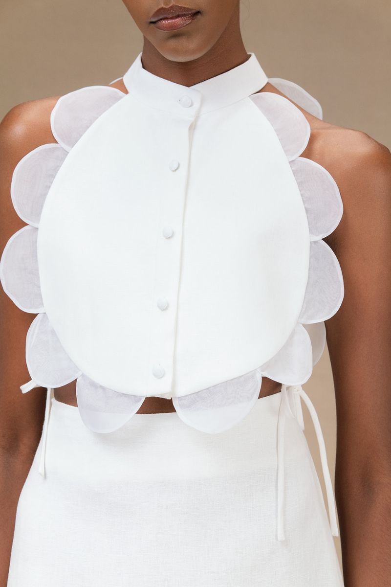 Ivory Bella Bib top by ANA + MARIA featuring soft fabric and stylish design, displayed on a mannequin.