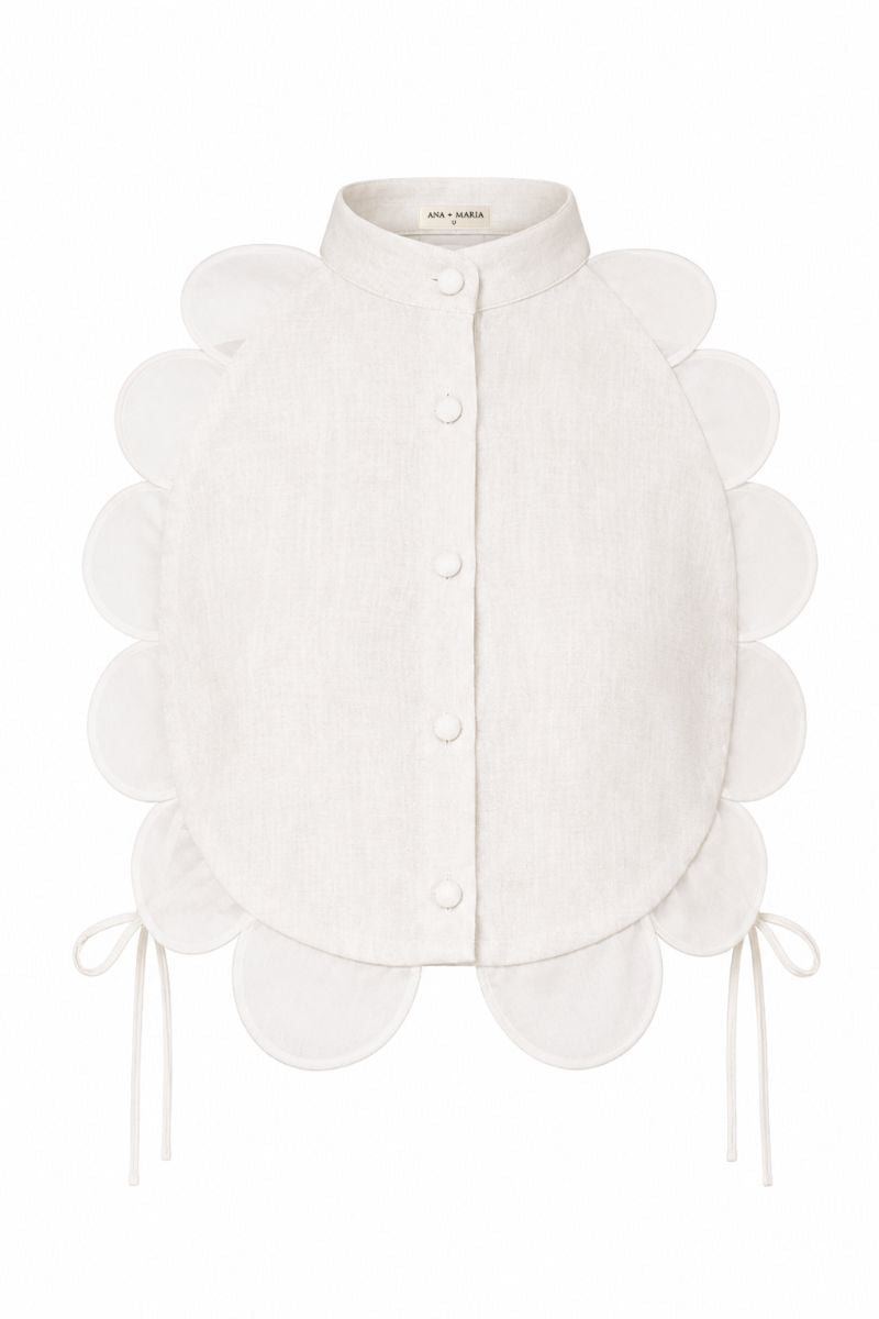 ANA + MARIA Bella Bib top in sandy color displayed on a ghost mannequin, showcasing its stylish design and fabric texture.