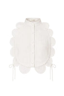 Sand-colored BELLA bib top by ANA + MARIA displayed on a ghost mannequin, showcasing its stylish design and fabric texture.