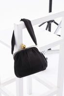 Black satin Bella shoulder bag with pomegranate embellishment by Sarah's Bag, featuring a sleek design and elegant style.