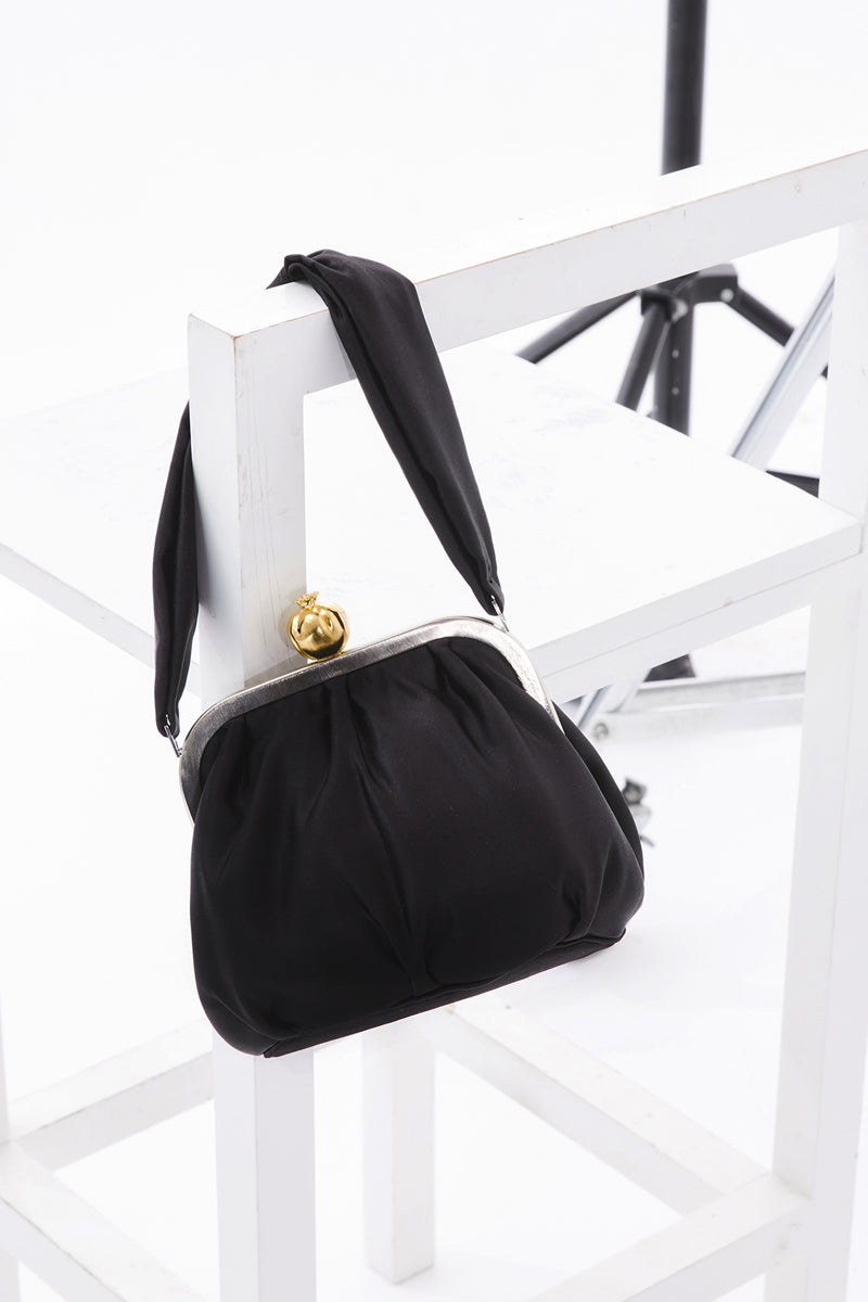 Black satin Bella shoulder bag with pomegranate embellishment by Sarah's Bag, featuring a sleek design and elegant style.