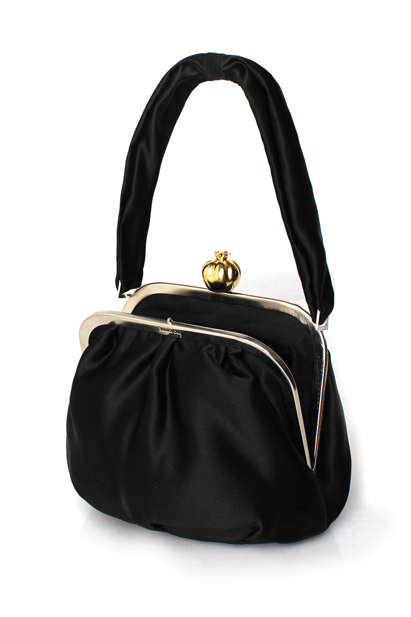 Open black satin shoulder bag by Sarah's Bag featuring a vibrant pomegranate design on the exterior.