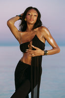 Black Belladonna maxi dress by Nana Jacqueline, one-shoulder design with flowing fabric, suitable for elegant occasions.