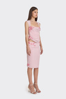 Pink lace corset top with draped design from Stolen Stores, featuring sheer fabric and intricate lace detailing.