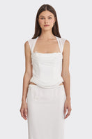 Off-white lace corset top with draped design by Stolen Stores, featuring sheer fabric and intricate lace details.