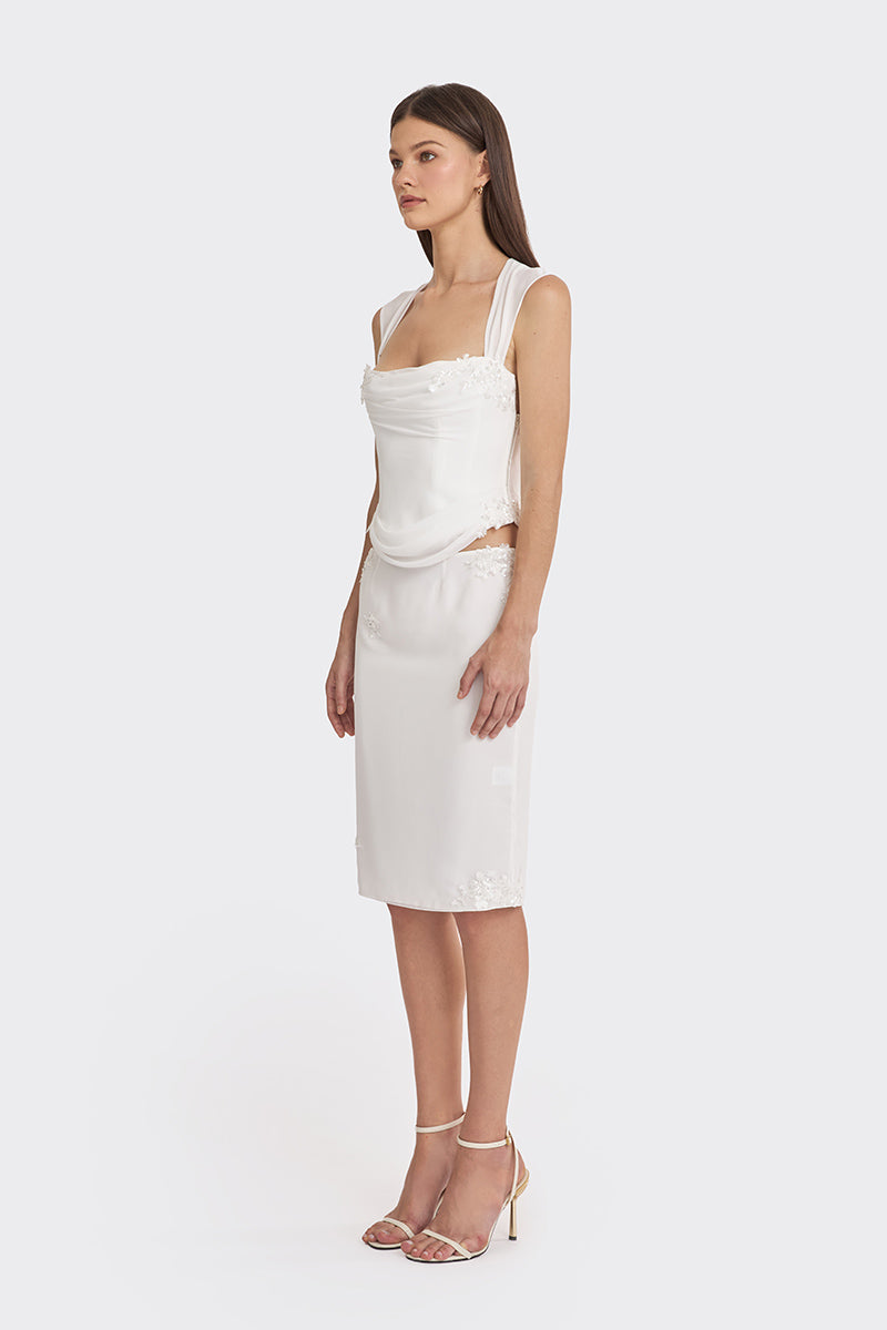 Off-white lace draped corset top by Stolen Stores with sheer fabric and intricate lace detailing.