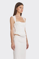Off-white lace corset top with draped design by Stolen Stores, featuring sheer fabric and intricate lace details.