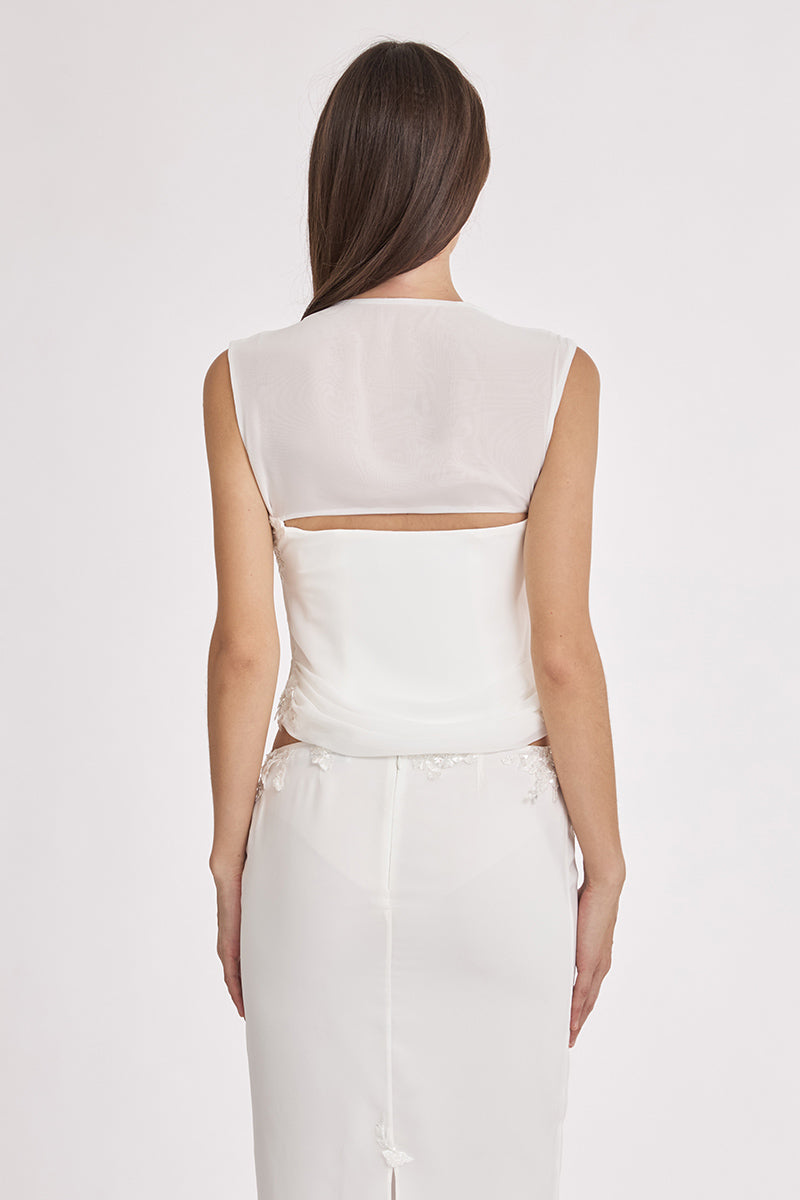 Off-white lace draped corset top by Stolen Stores featuring sheer fabric and intricate lace detailing.