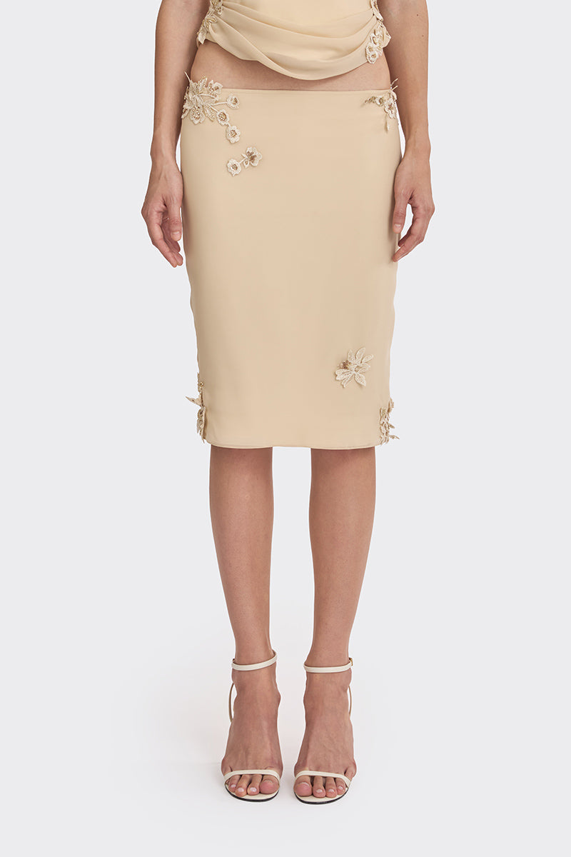 Cream Belle lace knee-length midi skirt from Stolen Stores, featuring delicate lace details and a classic silhouette.