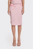 Pink lace knee-length midi skirt by Stolen Stores, featuring delicate lace details and a feminine, flowing silhouette.