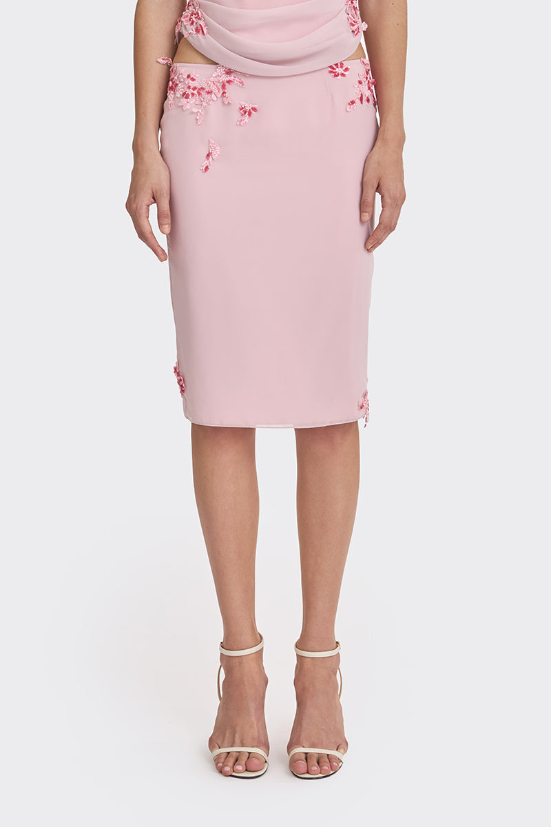 Pink lace knee-length midi skirt by Stolen Stores, featuring delicate lace details and a feminine, flowing silhouette.