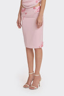 Pink lace knee-length midi skirt from Stolen Stores, featuring delicate lace details and a feminine silhouette.