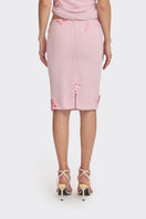 Pink lace knee-length midi skirt from Stolen Stores, featuring delicate detailing and a feminine silhouette.