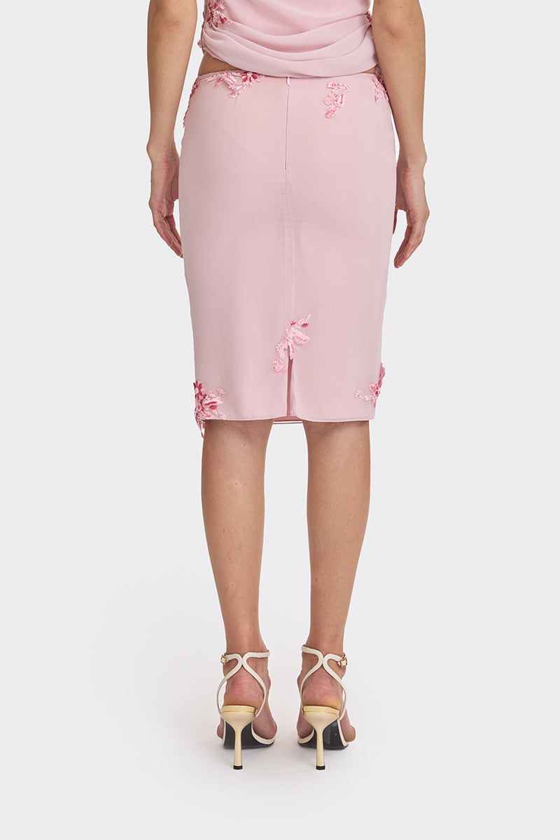 Pink lace knee-length midi skirt from Stolen Stores, featuring delicate detailing and a feminine silhouette.