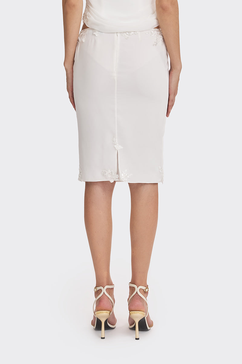 Off-white lace knee-length midi skirt from Stolen Stores with delicate detailing and a classic, elegant silhouette.