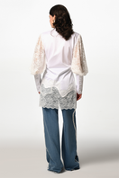 White Belle Sleeve Shirt by Liya featuring long sleeves and a relaxed fit, displayed on a hanger.
