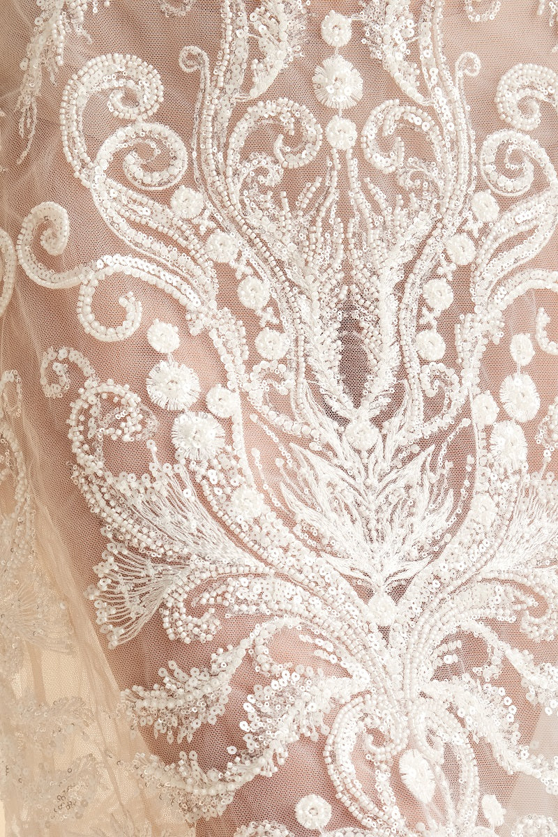 Scarlett Gasque Bianca Skirt in cloud dancer midi length with detailed fabric pattern and flowing design.