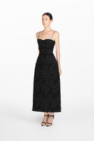 Side view of Montsand black crystal beaded midi dress showcasing intricate beadwork and elegant silhouette.