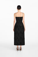 Back view of Montsand black crystal beaded midi dress with intricate beadwork and elegant design.