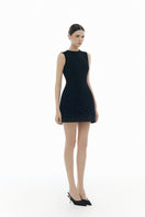 Black crystal beaded mini dress by Montsand, showcasing intricate beadwork and a sleek, fitted silhouette.