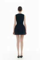 Black crystal beaded mini dress by Montsand featuring intricate beadwork and a sleek, fitted silhouette for elegant evening wear.