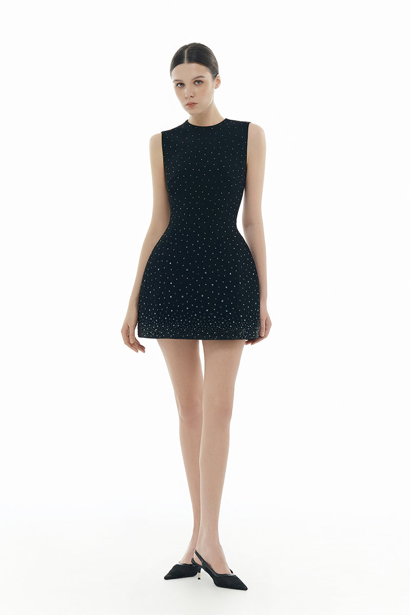 Black crystal beaded mini dress from Montsand, featuring intricate beadwork and a sleek, fitted silhouette.