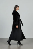 Black faux fur coat by Fortini, stylish old money-inspired design, shown on a model with a plush, luxurious appearance.