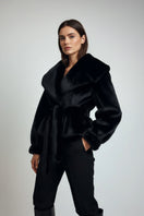 Black faux fur jacket by Fortini with a plush texture, stylish design, and classic old money-inspired look.