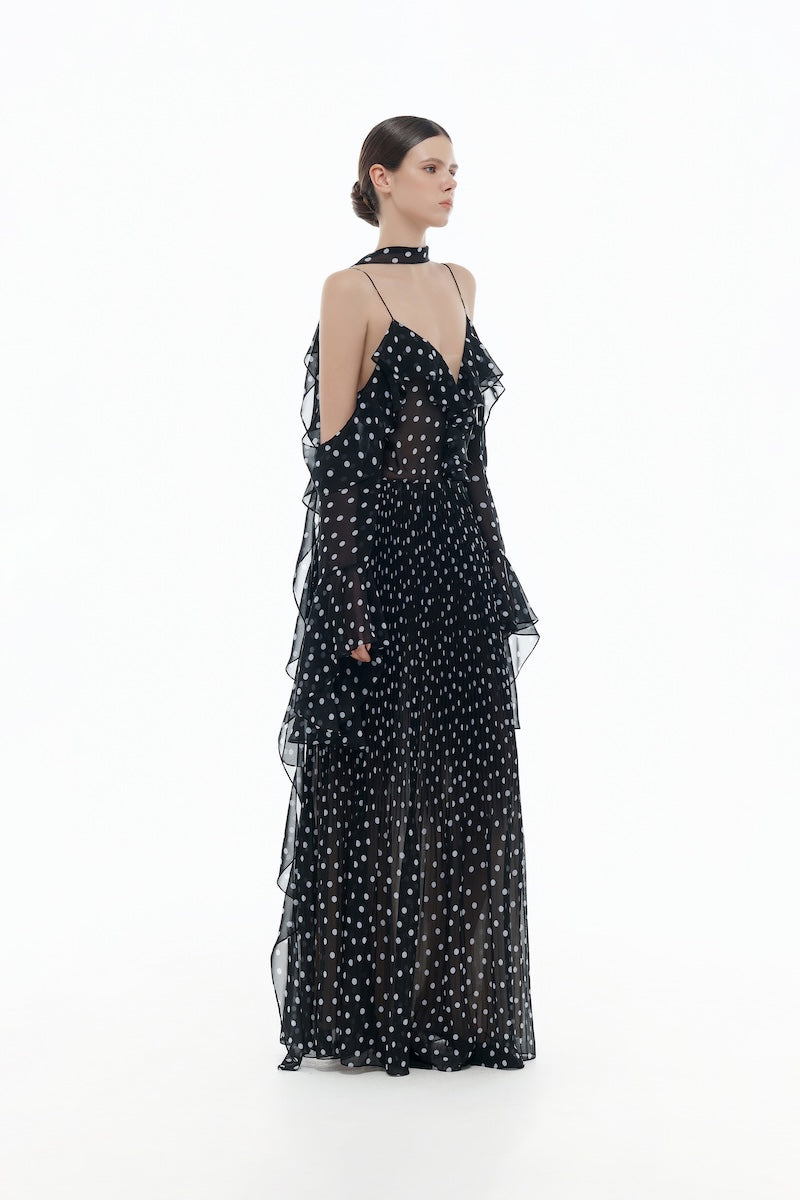 Black off-shoulder flowing maxi dress by Montsand, featuring a relaxed fit and elegant design, shown on a model.