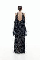 Black off-shoulder flowing maxi dress by Montsand, featuring a relaxed fit with long sleeves and elegant drape.