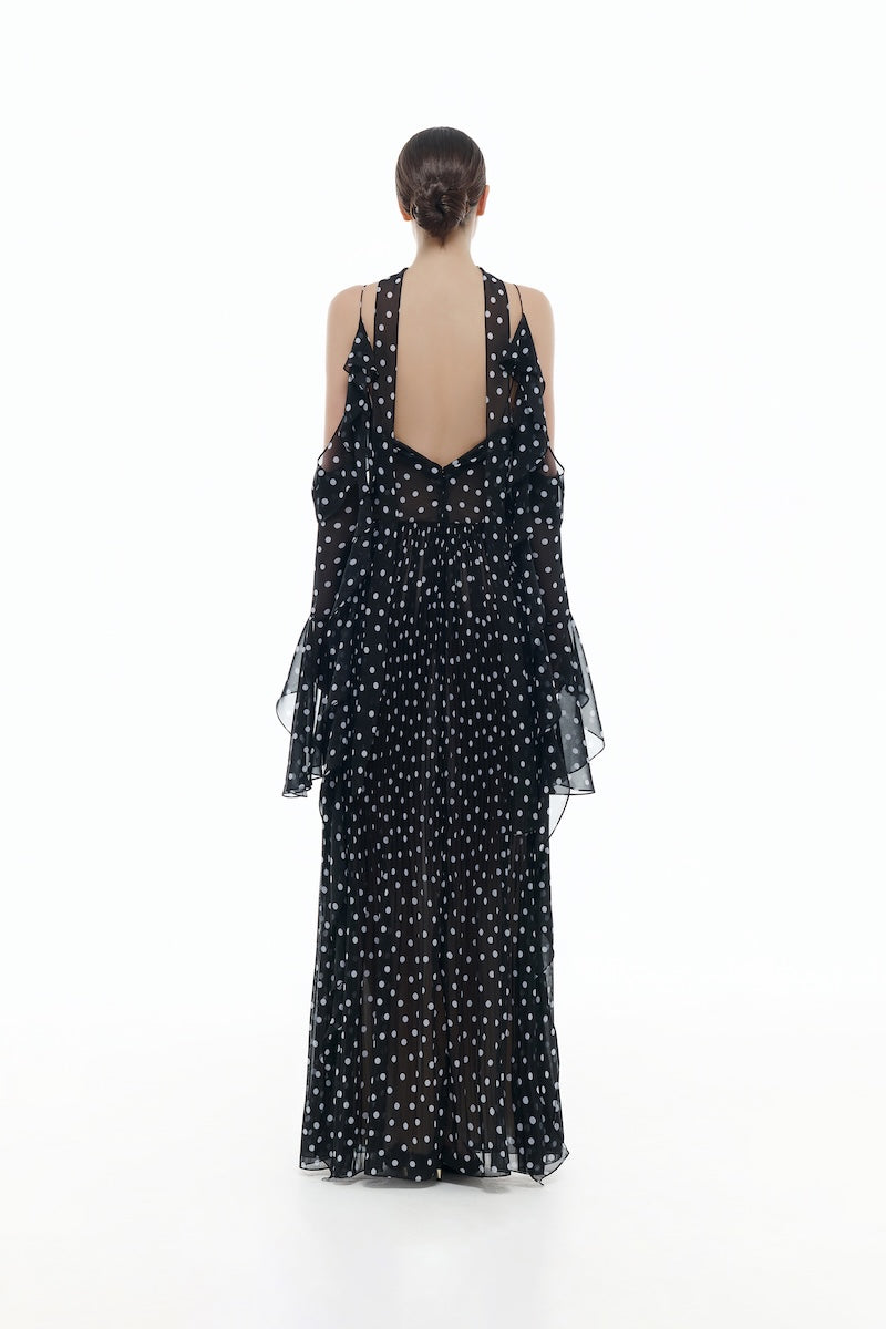 Black off-shoulder flowing maxi dress by Montsand, featuring a relaxed fit with long sleeves and elegant drape.