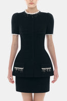 Black short sleeve tweed blazer by Montsand, shown with a matching black tweed skirt, stylish and tailored for a sophisticated look.
