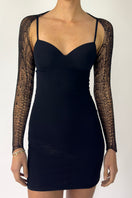 Black chain bolero shrug cardigan by Natalia Fedner featuring intricate chain detailing and a sleek black finish.