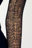 Close-up of Natalia Fedner black chain bolero shrug cardigan with intricate chain details and textured fabric.